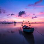 Solnedgang og båd